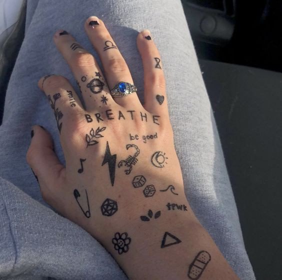 25 Tiny Hand Tattoo Ideas for Women That Are Trending in 2024